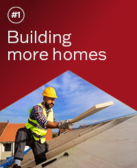 Red background reading: '#1, Building more homes' with a housing construction worker on a roof as the focal image underneath
