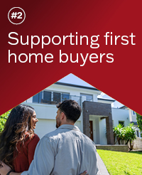 A couple standing arm in arm looking at their new house. Text reads '#2 Supporting first home buyers'