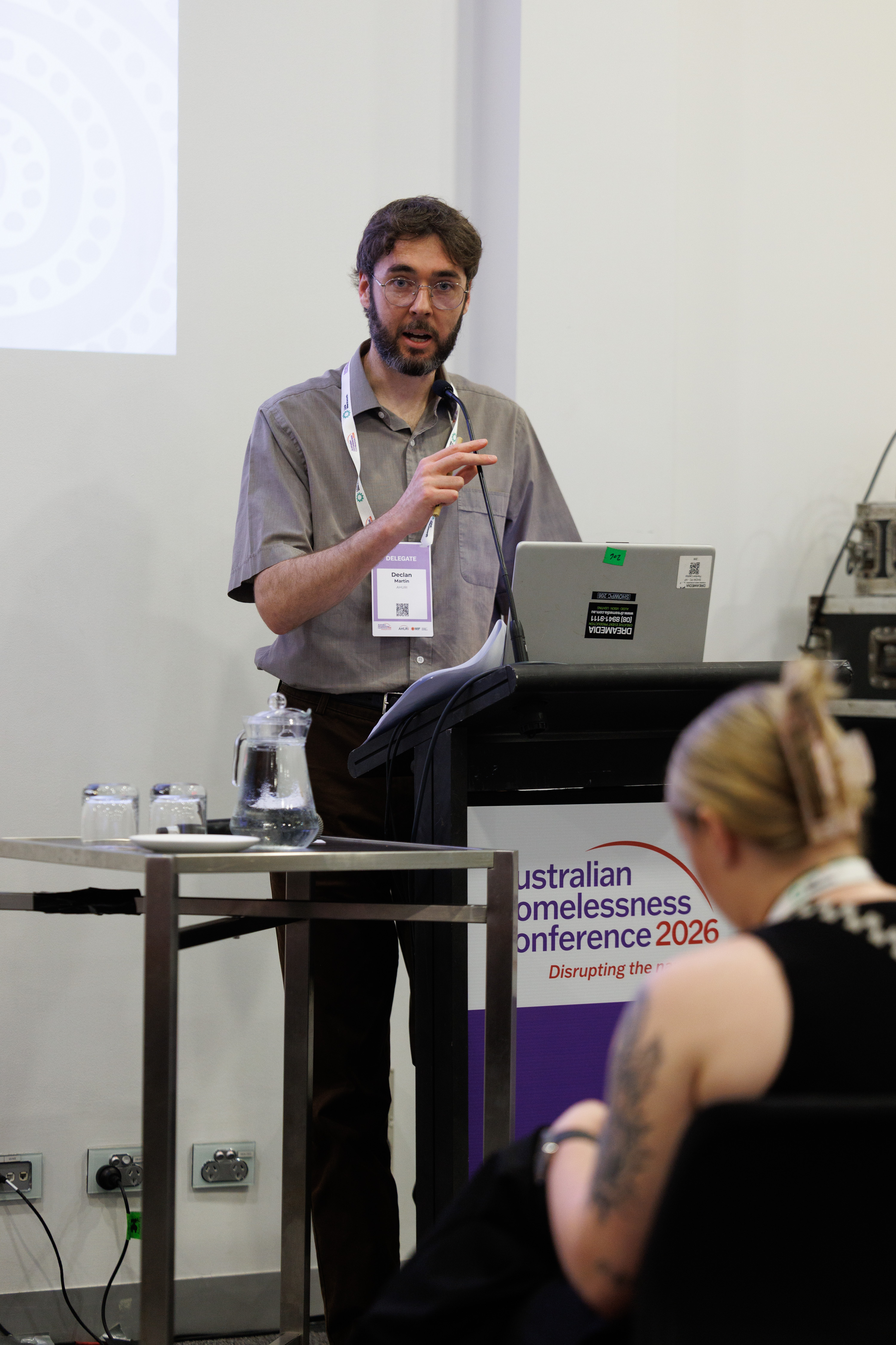Dr Declan Martin addressing crowd in session at Australian Homelessness Conference 2026