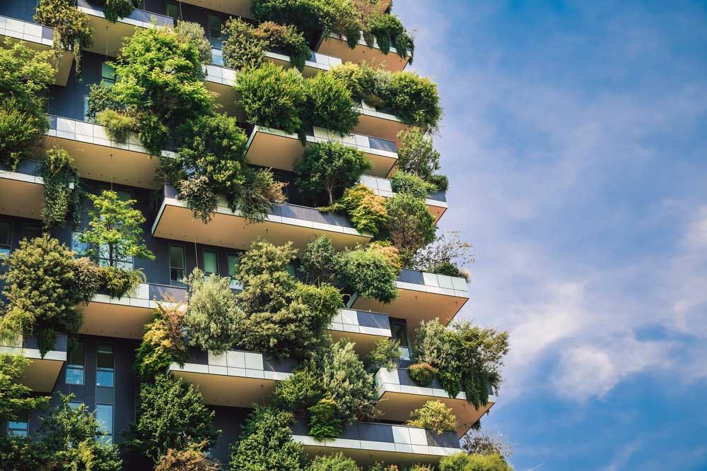 View of building with vertical gardens and blue skies with light clouds