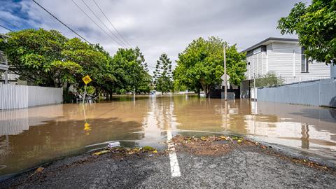 Ground level view of a flooded rural Australian street in daylight