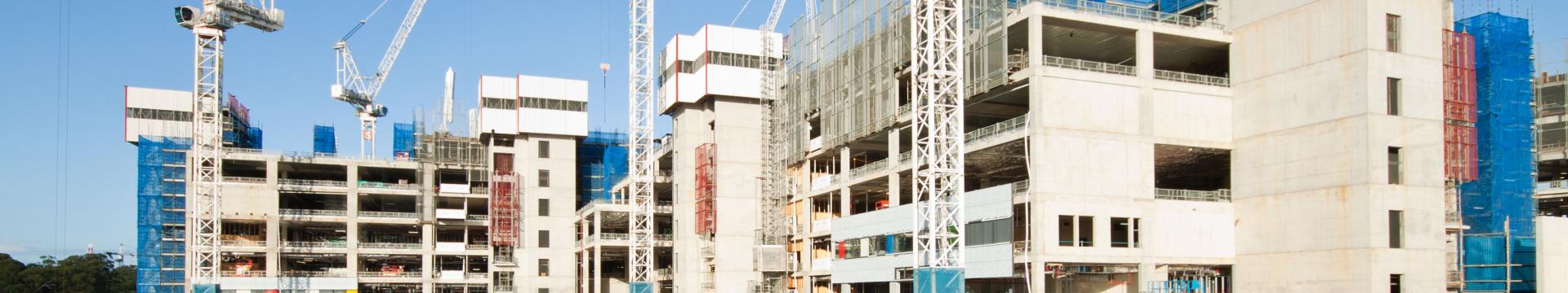 city construction site with apartments and cranes